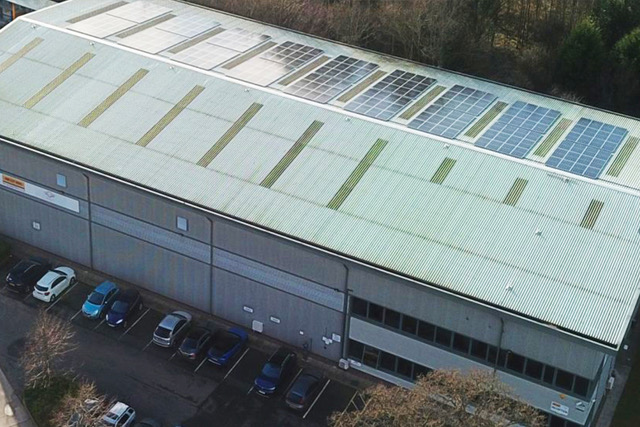Arial shot of a warehouse with soalr panels installed