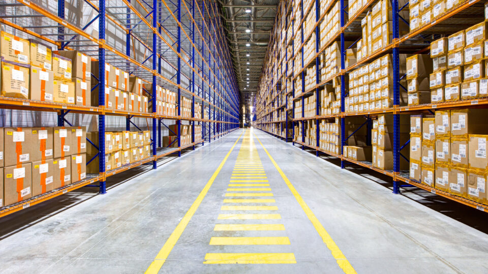Rows of industrial warehouse wide aisle racking