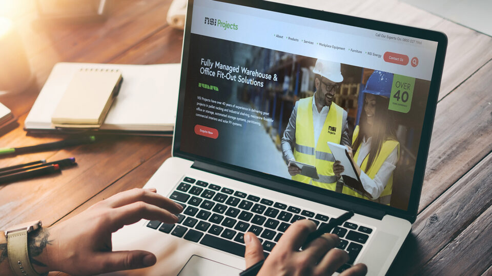 Close up of hands using laptop on the NSI Projects website