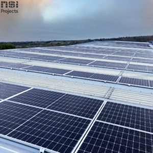 Wider shot of warehouse roof with NSI Projects soalr panels